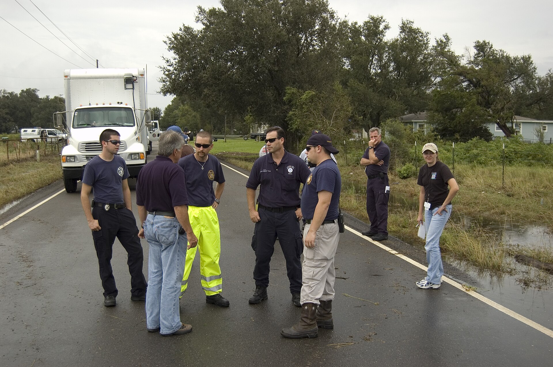 Lake Charles, LA, September 14, 2008 -- Urban Search and Rescue (USAR) teams discuss rescue efforts in Calcasieu Parish with FEMA PIO Jack Heesch . Calvin Tolleson/FEMA